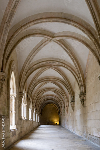 hallway and cloister with elaborate stonemasonry in the Alcobaca Monastery