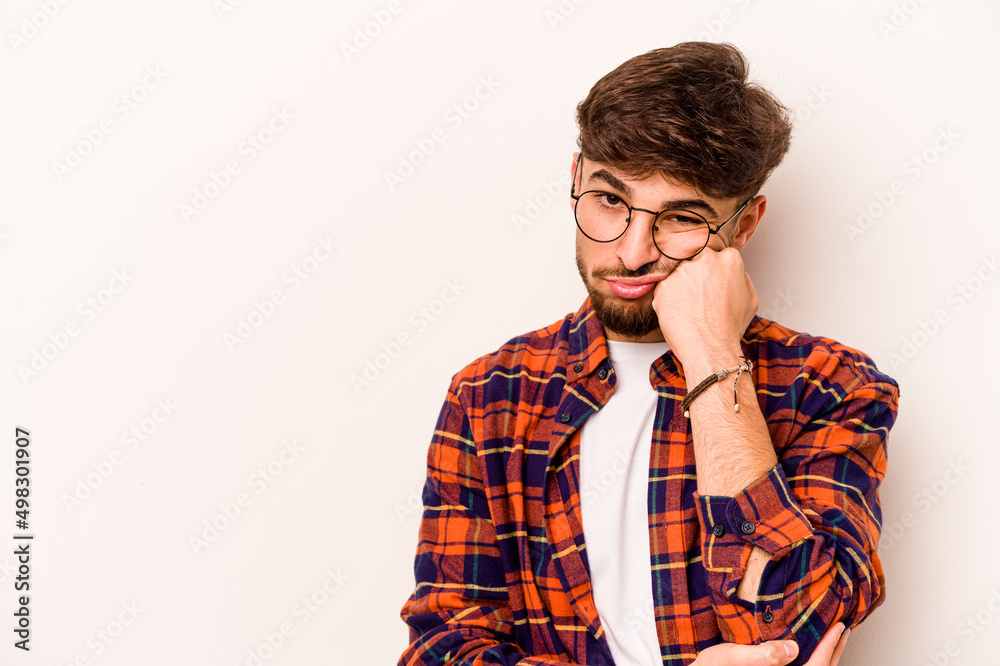 Young hispanic man isolated on white background who feels sad and pensive, looking at copy space. Young hispanic man isolated on white background who feels sad and pensive, looking at copy space.