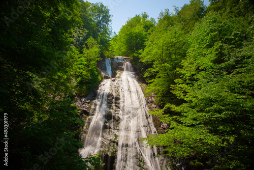 Waterfall; a long and beautiful waterfall is between the forest trees in Turkey Duzce; local name is Guzeldere, selective focus photo