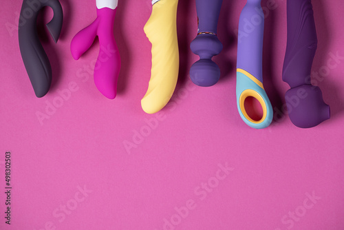 Sex toys. Many vibrators on a bright background. Useful for adult and sex shop photo