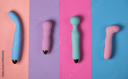Sex toys. Many vibrators on a bright background. Useful for adult and sex shop