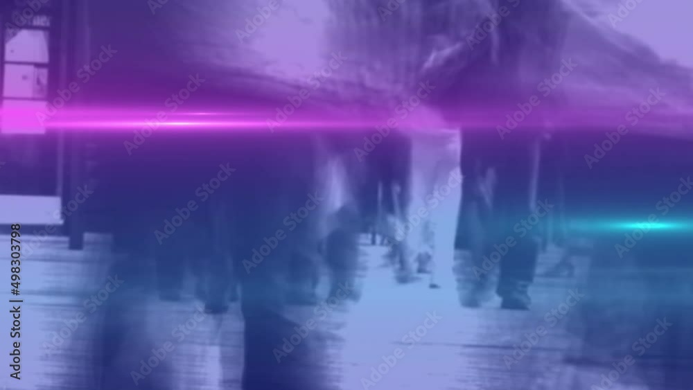 Video of coloured lights over crowd walking to work in street