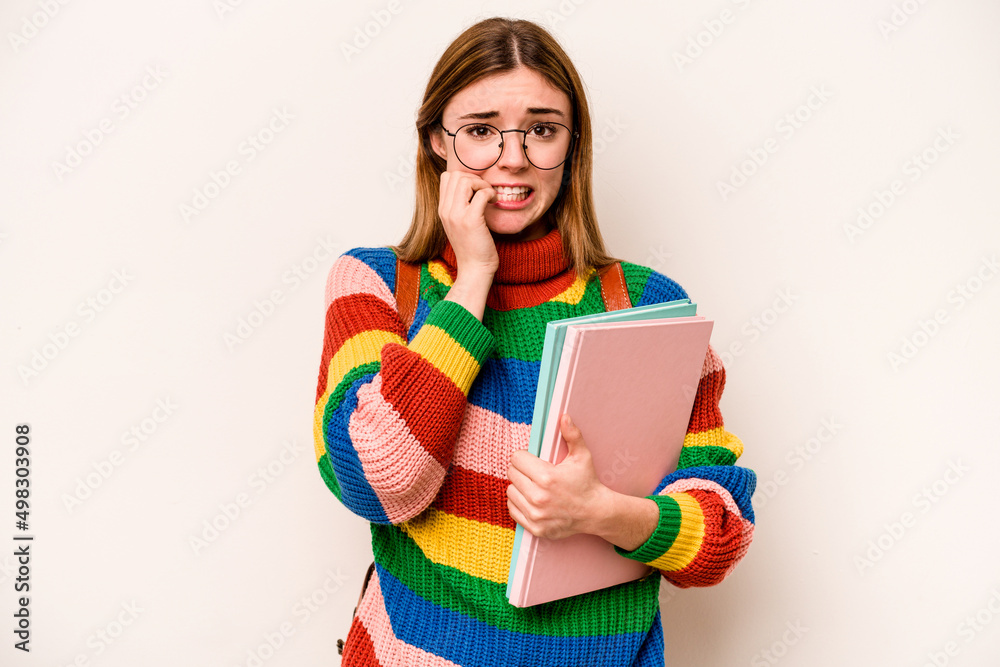 Young student caucasian woman isolated on white background biting fingernails, nervous and very anxious. Young student caucasian woman isolated on white background biting fingernails, nervous and very anxious.