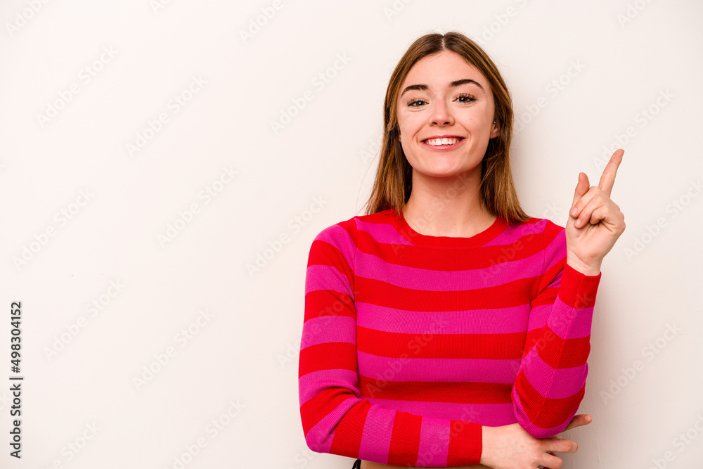 Young caucasian woman isolated on white background showing number one with finger. Young caucasian woman isolated on white background showing number one with finger.