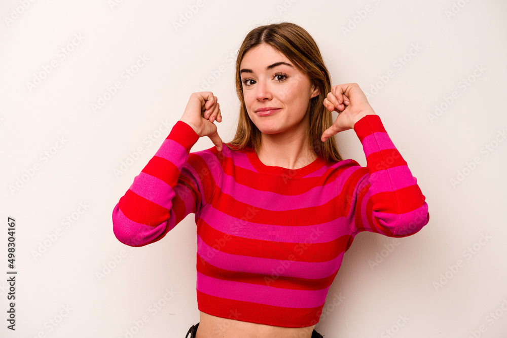 Young caucasian woman isolated on white background feels proud and self confident, example to follow. Young caucasian woman isolated on white background feels proud and self confident, example to follow.