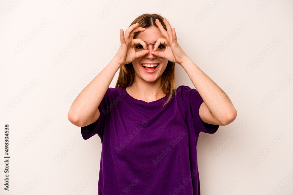 Young caucasian woman isolated on white background excited keeping ok gesture on eye. Young caucasian woman isolated on white background excited keeping ok gesture on eye.