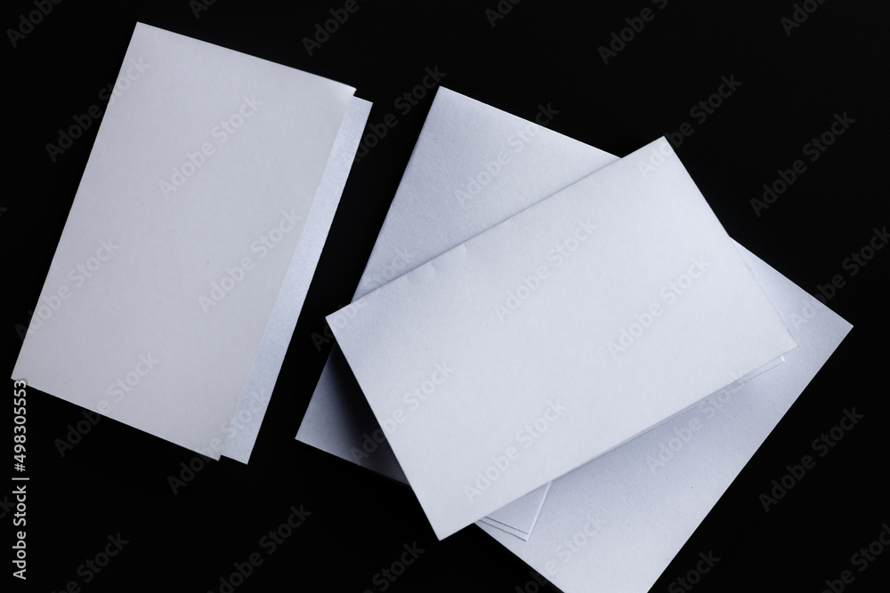 Blank Mock-up paper. brochure magazine isolated on black table, changeable background , white paper isolated on dark tone. Blank Mock-up paper. brochure magazine isolated on black table, changeable background , white paper isolated on dark tone.