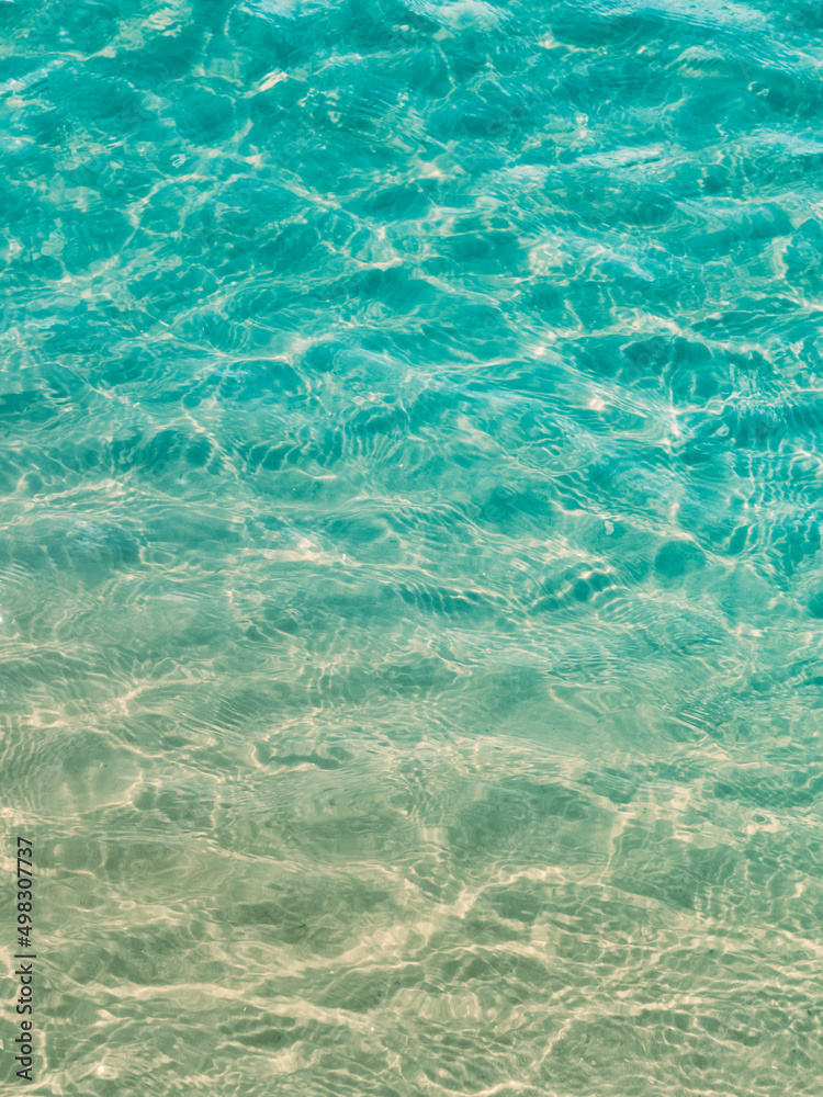 Surface transparent blue sea water.