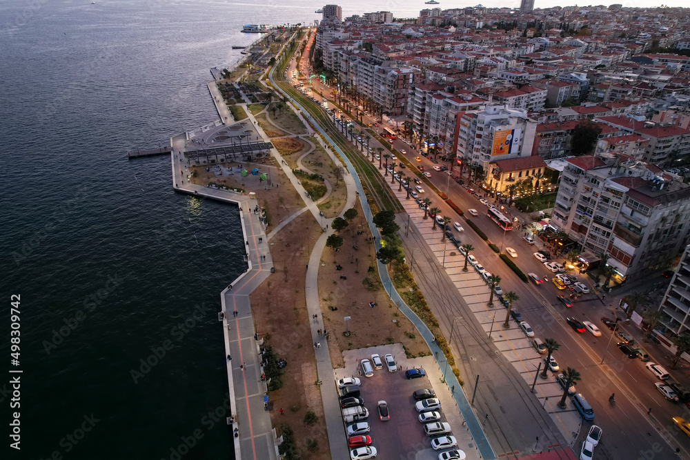 Izmir, Turkey - April 08, 2022: Karsiyaka, the largest district of Izmir. Coast , ferry pier drone photos .