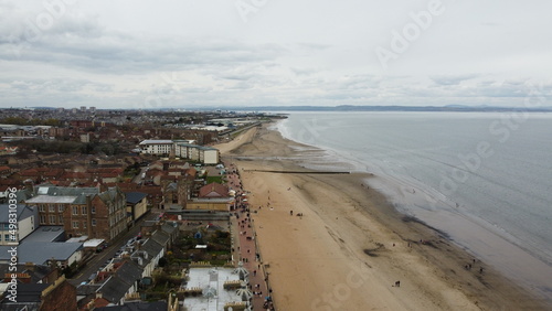 View of the coastline of Portobello Beach in Edinburgh. Portobello Beach, a few miles from Edinburgh city centre, is a charming seaside suburb.