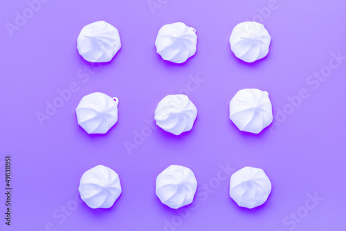 sweet meringue kiss cookies over Very Perry background, flat lay, top view