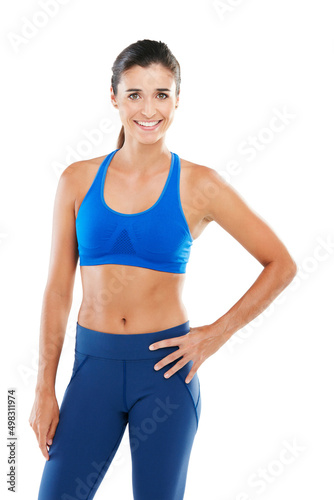 Feeling fit. Portrait of a sporty young woman standing against a white background.