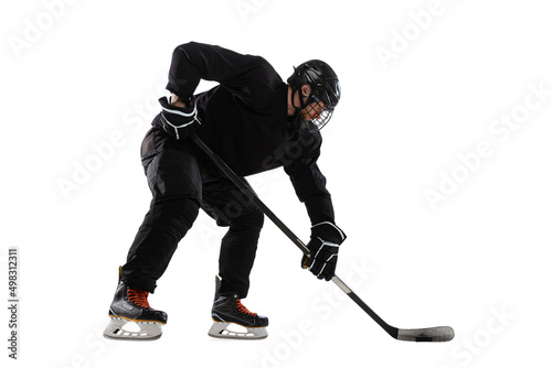 Full-length image of professional male hockey player training isolated over white background © master1305