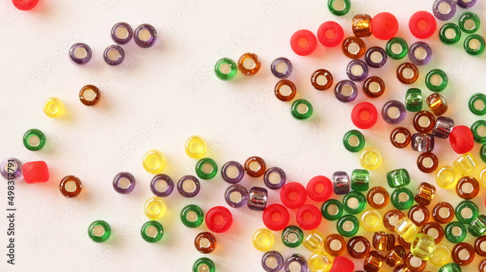 Glass beads mix. Different colors. Isolated on white background, top view. Glass beads mix. Different colors. Isolated on white background, top view.