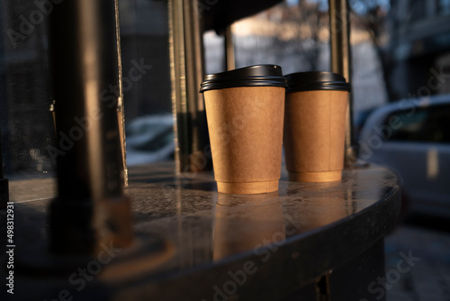 Craft paper coffee cups outdoors. High quality photo