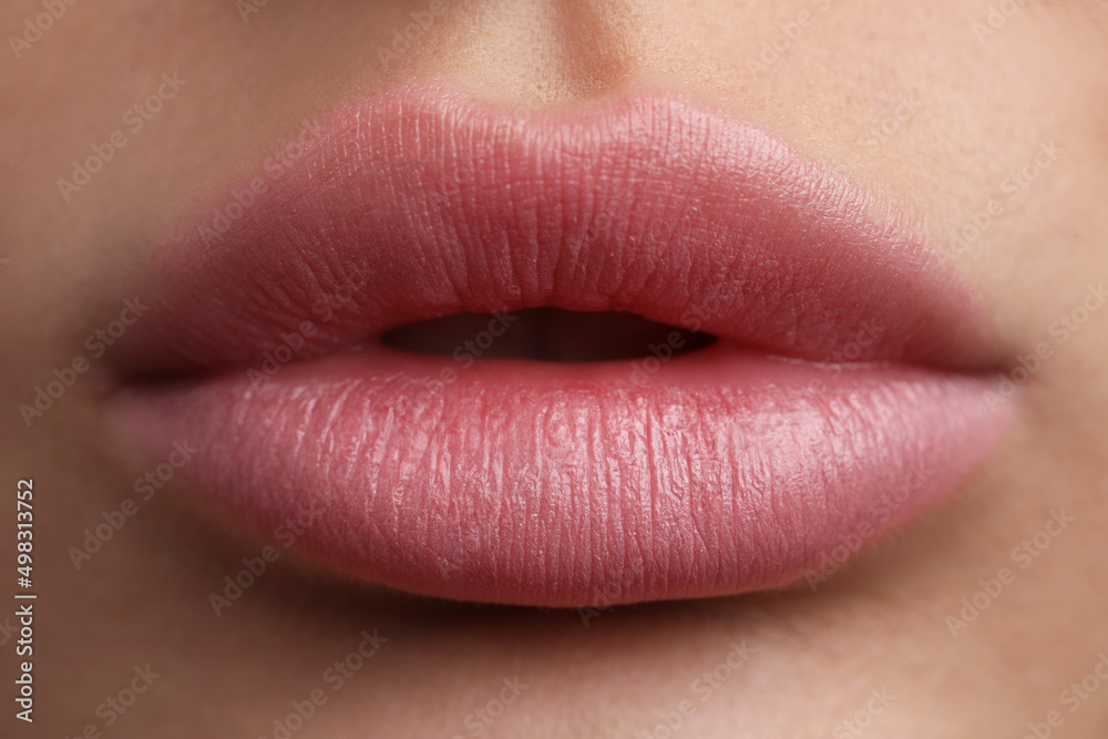 Young woman with beautiful lips, closeup view Young woman with beautiful lips, closeup view