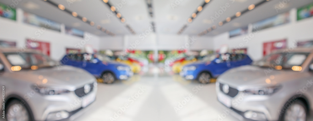 new cars in showroom interior blurred abstract background