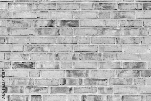 Brick wall. Light grey. Black and white photography.