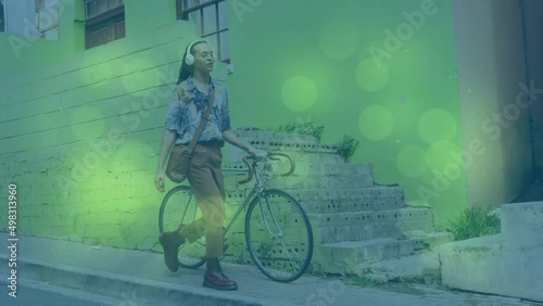 Wallpaper Mural Animation of shapes moving over african american man walking with bicycle Torontodigital.ca