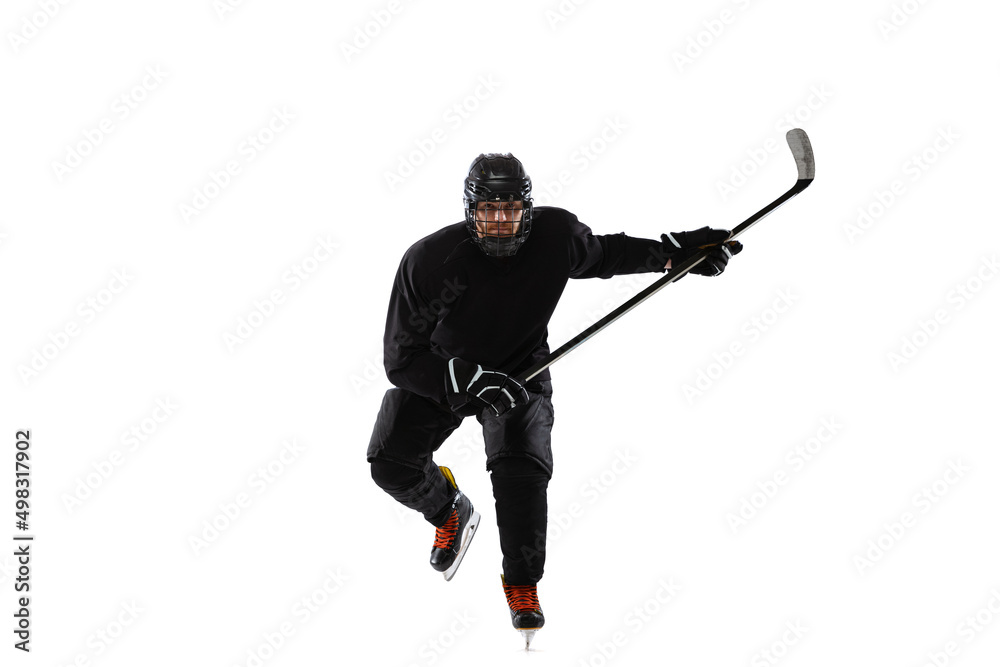 Portrait of professional male hockey player training isolated over white studio background Portrait of professional male hockey player training isolated over white studio background