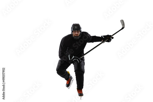 Portrait of professional male hockey player training isolated over white studio background