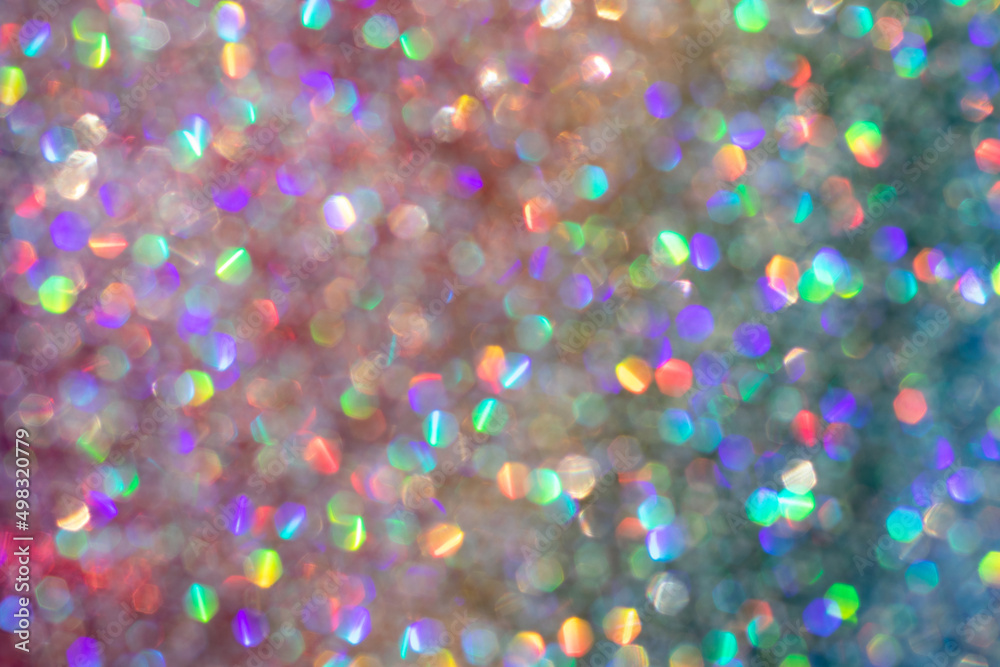 Abstract defocused multicolored background with shining glitter.Good as overlay layer.