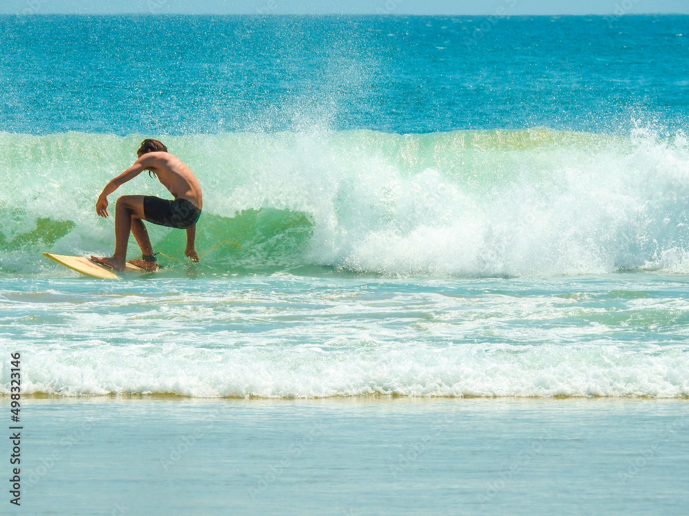 Surfer at Clarkes Beach, Byron Bay Surfer at Clarkes Beach, Byron Bay