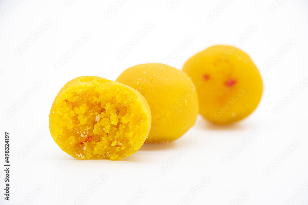 coconut laddoo slice closeup isolate on white background coconut laddoo slice closeup isolate on white background