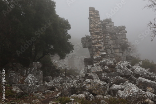 incredible Termessos, old ancient historic city site, old stones, cloudy fogy weather, Turkey , Güllük Dagi Termessos Milli Park photo