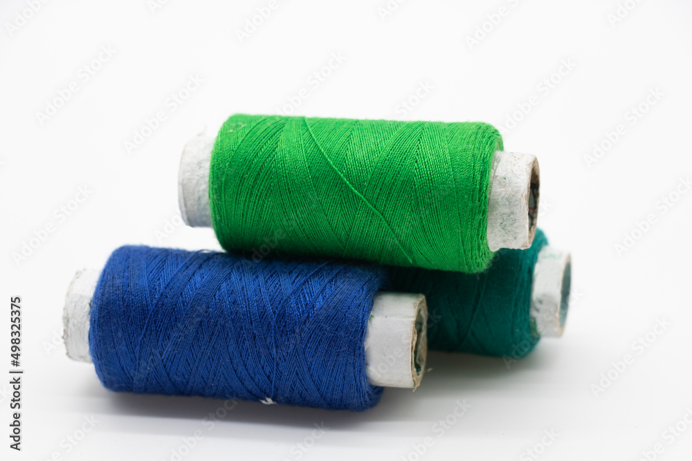 yarn or spool thread over on white background yarn or spool thread over on white background