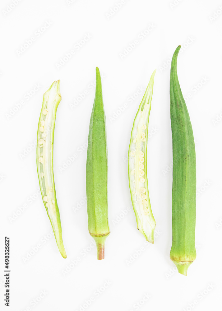 slices and whole of okra or Lady Finger over on white background, top view
