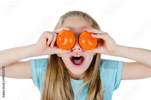 Healthy lifestyle people. Funny image of little girl showing mandarin orange. Isolated on white background