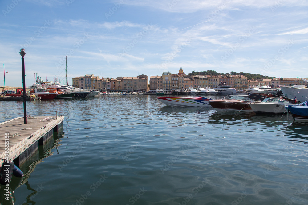 Saint Tropez, Provence, Côte d'azur, France: Panoramic view to the famous silhouette of the harbor with the church clock tower 
