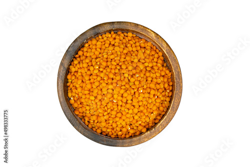 red lentils pulses in wooden bowl isolated on white background top view