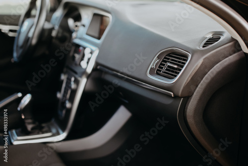 Air vent grill in modern car interior.