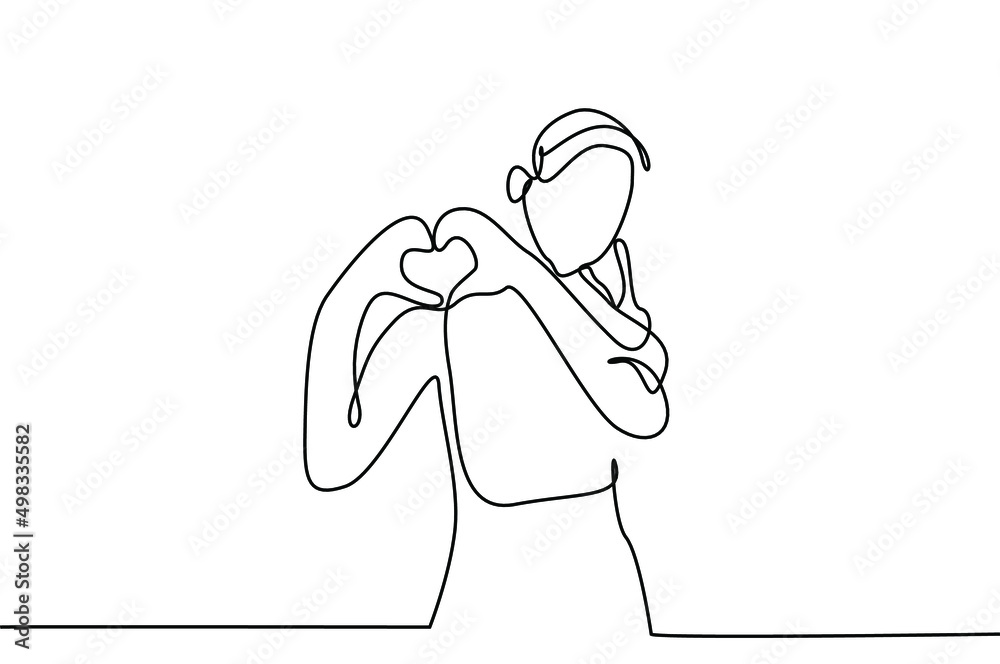 a person is making and showing a heart sign with her hands
a person is making and showing a heart sign with her hands