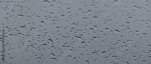 Rain drops on the glass. Banner with raindrops on the window