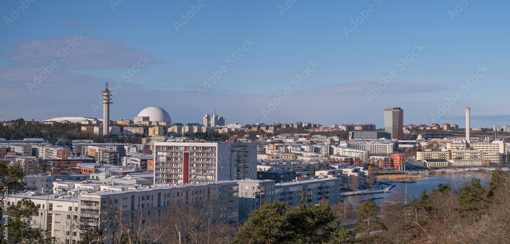 Panorama view over the district Hammarby sjö with apartments and the Globen, Avicii, arena a snowy spring day in Stockholm