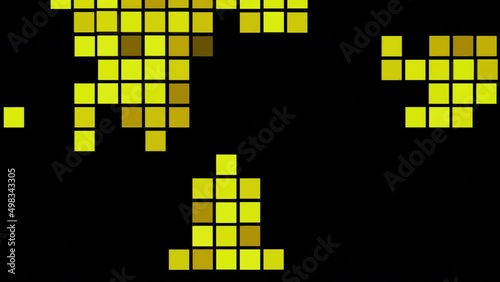 Black background.Design.Blue and yellow squares in abstraction run over a black background like tetris. photo