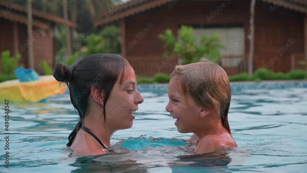Fun time. Games with children in the pool. parental attention. Fun time. Games with children in the pool. parental attention.