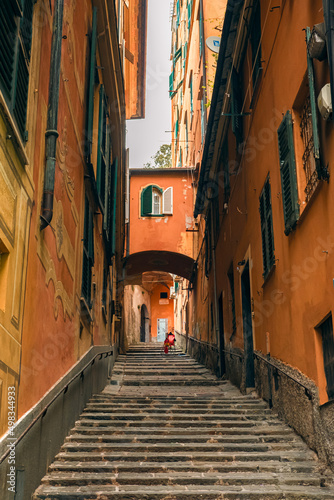 Stairs in a narrow Italian street. Colorful streets in Genoa.