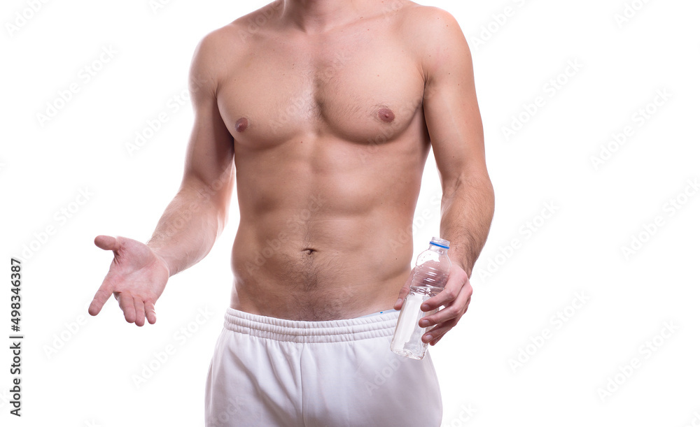 body of a young caucasian male athletic naked to the waist isolated on white background with a bottle of water in hand
