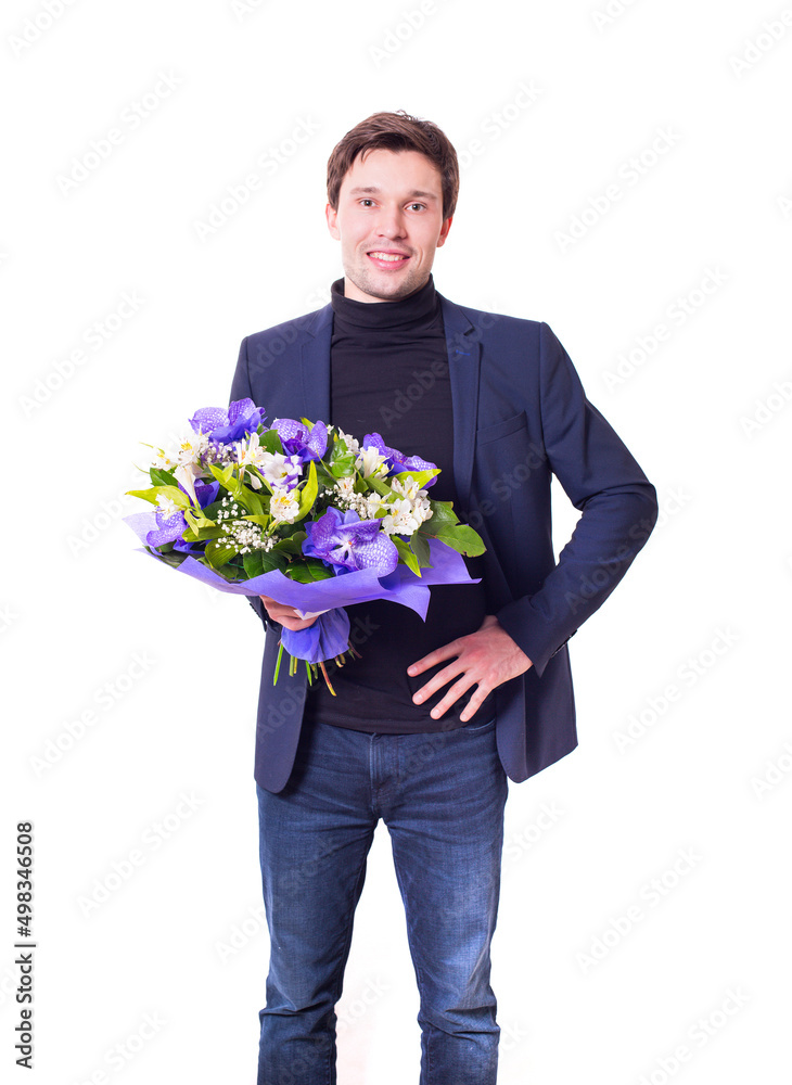 funny handsome young man with dark suit with a beautiful bouquet in the hands of white and purple flowers isolated on a white background funny handsome young man with dark suit with a beautiful bouquet in the hands of white and purple flowers isolated on a white background