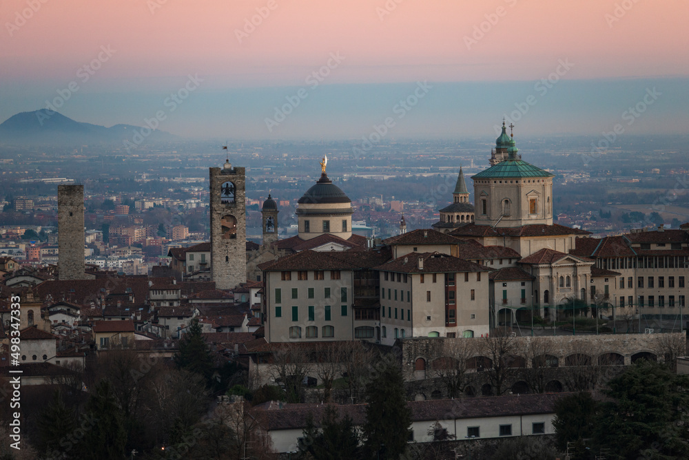View postcard upper town Bergamo sunset