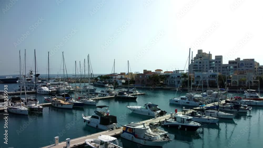 Drone flying over ships, yachts and boats in the old port in Limassol in Cyprus on a sunny spring day. Drone flying over ships, yachts and boats in the old port in Limassol in Cyprus on a sunny spring day.