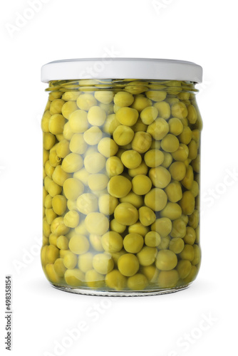 Green peas in the glass jar isolated on white.