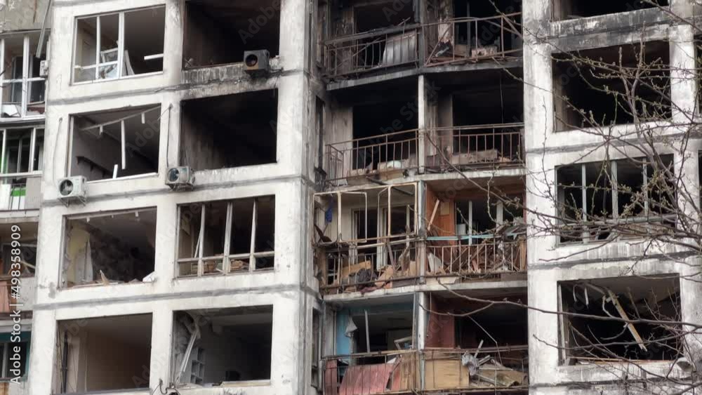 Burnt destroyed facade with broken windows of a high-rise apartment building in Kyiv after a missile strike during Ukraine's war with Russia in 2022 Burnt destroyed facade with broken windows of a high-rise apartment building in Kyiv after a missile strike during Ukraine's war with Russia in 2022