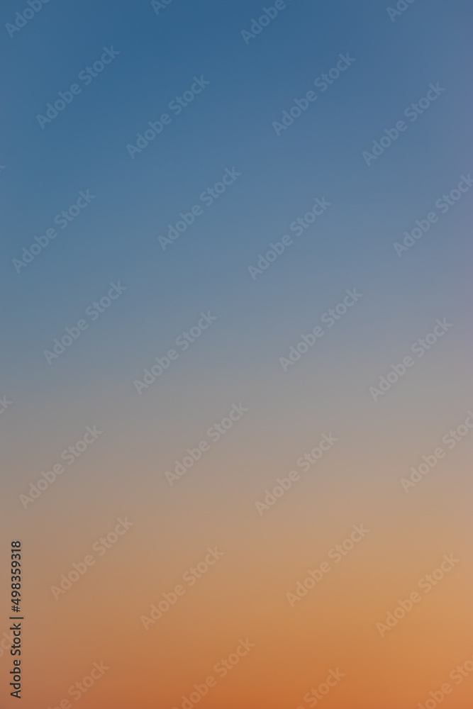 The gradient sky is blue-orange. A wonderful background for design.