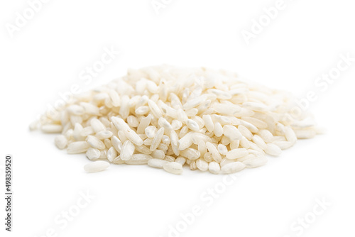 Uncooked Carnaroli risotto rice isolated on white background.