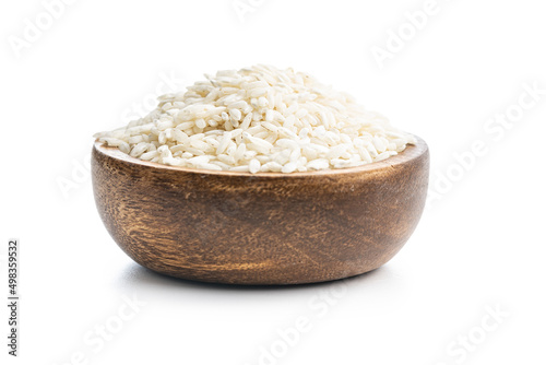 Uncooked Carnaroli risotto rice in bowl isolated on white background. photo